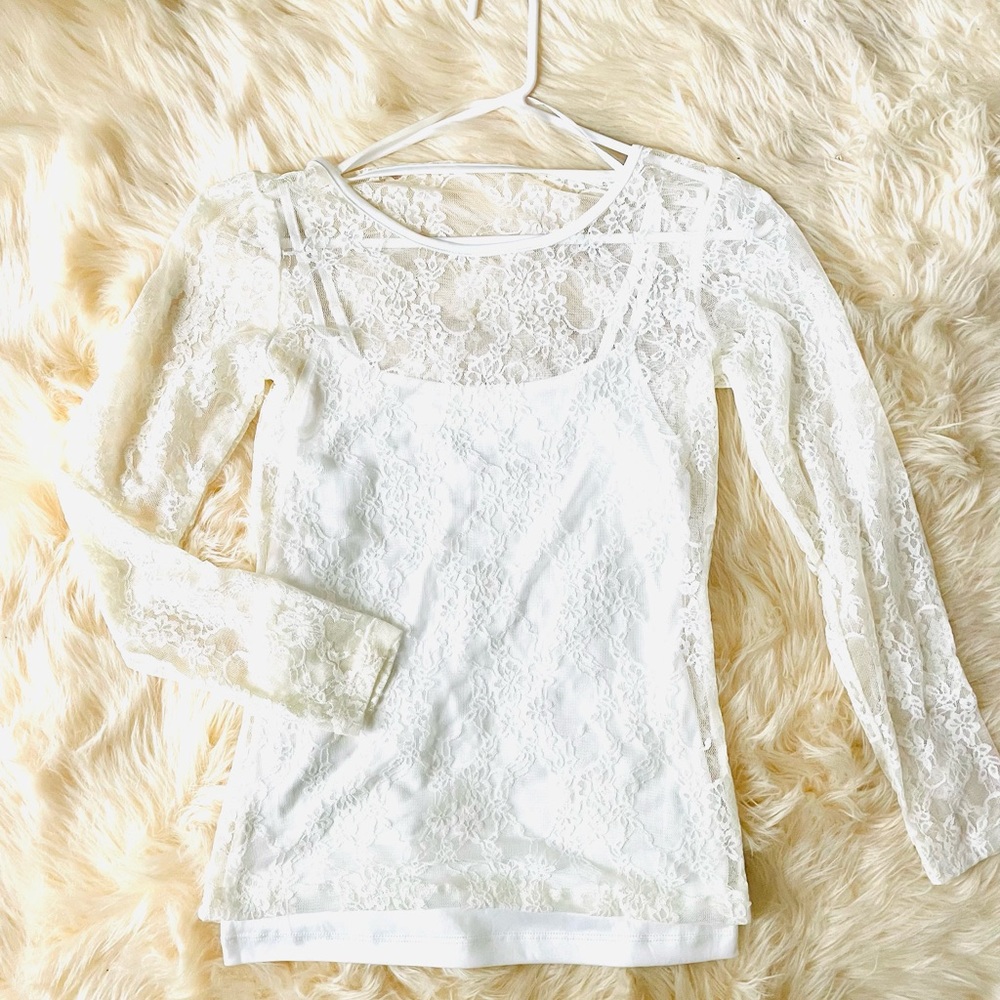 White lace blouse with a white spaghetti strap top